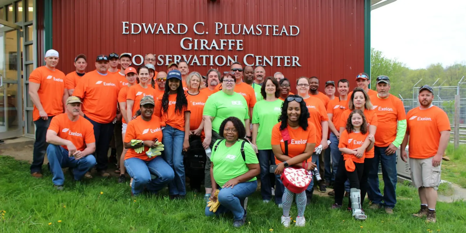 Volunteer group in front of the Edward C. Plumstead Giraffe Conservation Center