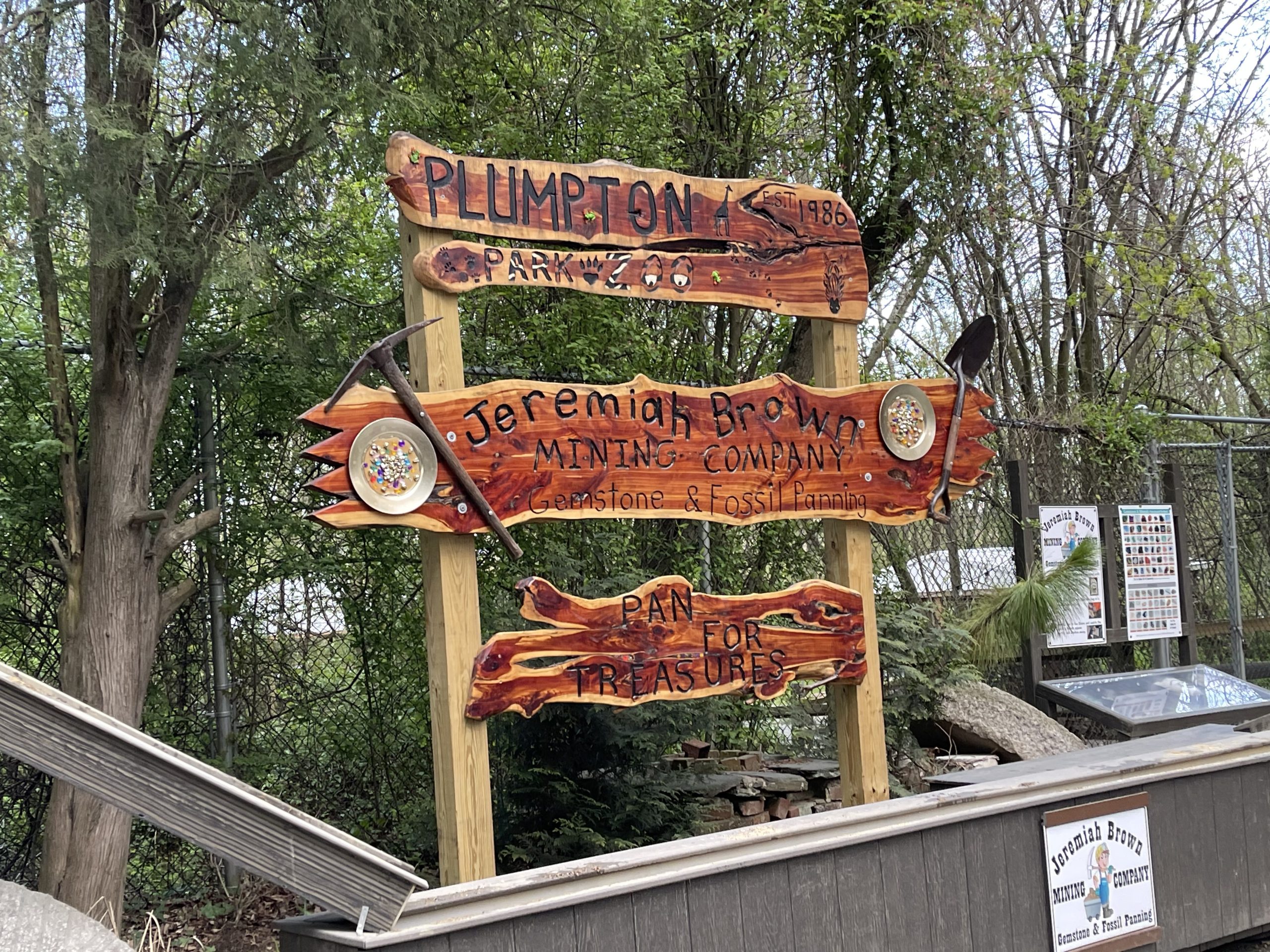 Children panning for gemstones and fossils at the Jeremiah Brown Mining Company sluice at Plumpton Park Zoo in Rising Sun, Maryland